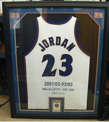 Picture of FRAMED MICHAEL JORDAN SIGNED JERSEY AND CARD