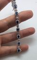 Picture of 14kt white gold bracelet 7 inch with 2.5 carat of diamonds (247 round diamonds ) and 13 blue oval sapphires  . Total weight 18.6 gr . 840878-1. Used.