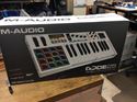 Picture of M-audio mixing board midi control code 25 new . In box .