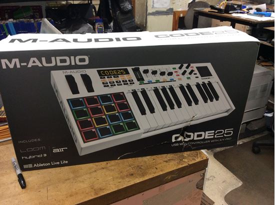 Picture of M-audio mixing board midi control code 25 new . In box .