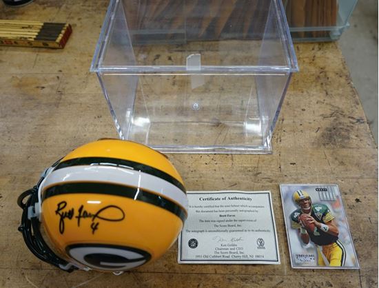 Picture of BRETT FAVRE SIGNED MINI HELMET WITH CASE; COA; AND FOOTBALL CARD MINT COLLECTIBLE. 