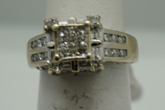 Picture of 14KT WHITE GOLD RING 5.5GR WITH 0.75PTS OF DIAMONDS (16 ROUND DIAMONDS ; 8 BAGUETTES; 9 PRINCESS CUT ) SIZE 5.25 GOOD CONDITION. PRE OWNED. 796205-1. 