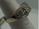 Picture of 14KT WHITE GOLD RING 5.5GR WITH 0.75PTS OF DIAMONDS (16 ROUND DIAMONDS ; 8 BAGUETTES; 9 PRINCESS CUT ) SIZE 5.25 GOOD CONDITION. PRE OWNED. 796205-1. 