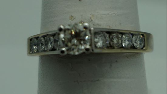 Picture of 14kt white gold engagement ring 3.7 gr with round 0.50 pts main diamond and 8 side diamonds 0.50 size 7.5 804403-1