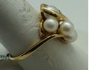 Picture of 14kt yellow gold ring size 9.5 with pearls and diamonds . 2 diamonds small. 4 pearls . Total weight 5.6gr. Pre owned. 838381-1.