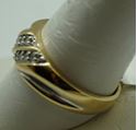 Picture of 14kt yellow gold ring size 10 with 8 diamonds 0.10 total diamond weight . Total weight 4gr. Pre owned. 846228-1 