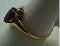 Picture of 10kt yellow gold ring with red margie stone size 8.25 2.0gr very good condition . pre owned. 852046-1. 