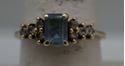 Picture of 10KT YELLOW GOLD RING WITH BLUE STONE AND  8 CZS SIZE 8.5 2.4 GRAMS  VERY GOOD CONDITION. 849283-1. 