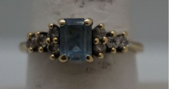 Picture of 10KT YELLOW GOLD RING WITH BLUE STONE AND  8 CZS SIZE 8.5 2.4 GRAMS  VERY GOOD CONDITION. 849283-1. 