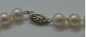 Picture of 26 INCH LONG  PEARL PEACH COLOR (7MM)  NECKLACE WITH 14KT WHITE GOLD CLASP VERY GOOD CONDITION. WITH CASE.