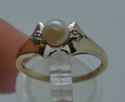 Picture of 10 kt yellow gold ring size 6.5 2.3 gr with 5.5 mm pearl and 2 small diamonds (0.01 pts ) . pre owned. very good condition. 850319-1.