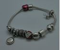 Picture of PANDORA STERLING SILVER BRACELET WITH 12 CHARMS 49.9 GRAMS PRE OWNED 851137-1 