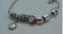 Picture of PANDORA STERLING SILVER BRACELET WITH 12 CHARMS 49.9 GRAMS PRE OWNED 851137-1 