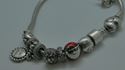 Picture of PANDORA STERLING SILVER BRACELET WITH 12 CHARMS 49.9 GRAMS PRE OWNED 851137-1 