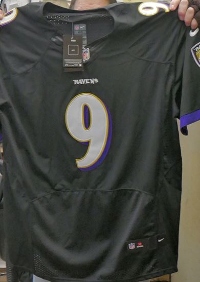 Picture of Justin Tucker Baltimore Ravens Autographed Black Custom Jersey JSA Authenticated.  VERY GOOD CONDITION. JSA CERTIFIED W270687.