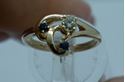 Picture of 14KT YELLOW GOLD RING 2.7 GR W ROUND DIAMOND 0.15PTS & 2 ROUND SAPPHIRES SIZE 5 .  PRE OWNED. VERY GOOD CONDITION. 825182-1.