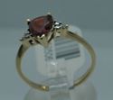 Picture of 10KT YELLOW GOLD RING WITH  PEAR SHAPE GARNET SMALL DIAMONDS 1.5 GRAMS SIZE 7.25. PRE OWNED. VERY GOOD CONDITION. 853506-1.