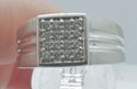 Picture of 10kt white gold men's ring w diamonds; 6.8 grams; 0.75 carat of round diamonds; size 9.5. pre owned . very good condition. 840013-1.