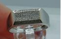 Picture of 10kt white gold men's ring with 0.25 carat of diamonds; 3.8 grams; size 11.5. pre owned. very good condition. 831278-2. 