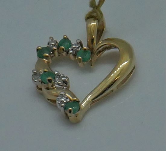 Picture of 10kt yellow gold heart pendant with 2 small diamonds and 5 emeralds 1.5 grams 817670-1