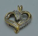 Picture of 10kt yellow gold 2.6 grams diamond heart pendant 14 round .16 baguette diamonds 0.25 ctw 806514-1