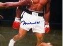 Picture of " MUHAMMAD ALI KNOCKS OUT SUNNY LISTON" . AUTOGRAPHED. FRAME SIZE 22X25 . PICTURE SIZE 19X22. WITH GRANDSTAND SPORT HOLOGRAM, ONLINE AUTHENTIC HOLOGRAM .