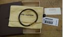 Picture of Louis Vuitton cowhide leather bracelet M6609D pre owned with case and dust bag.  pre owned. very good condition. 